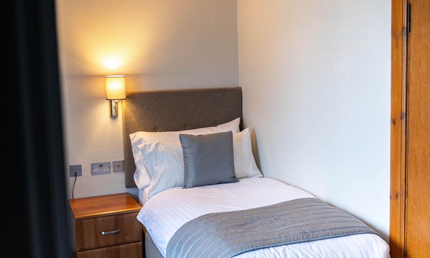 Hotel bedroom with single bed