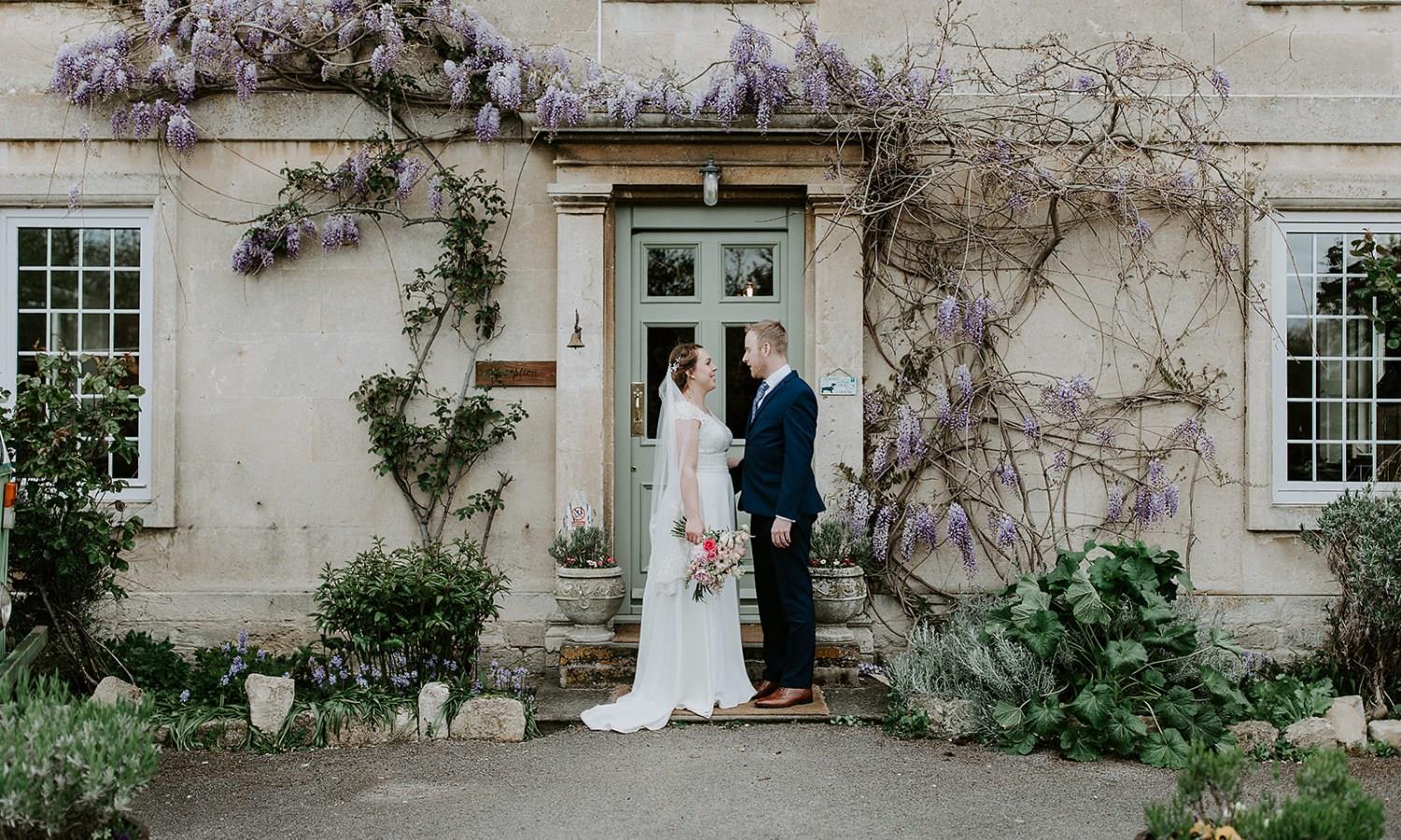 Wedding couple outside hotel wedding venue