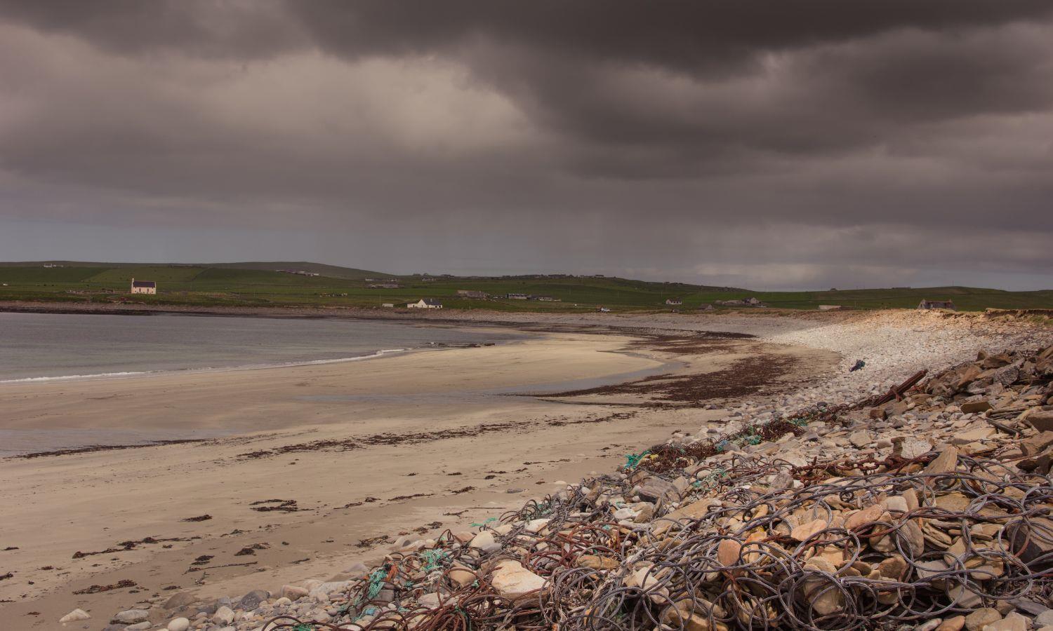 Beach at Skara Brae in Orkney during a storm