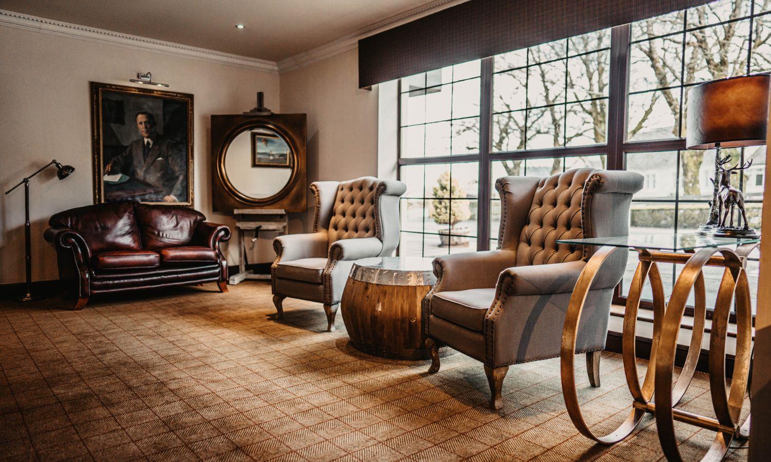 Boutique hotel interior at the Broadford Hotel featuring Highland-style interior and comfy seating