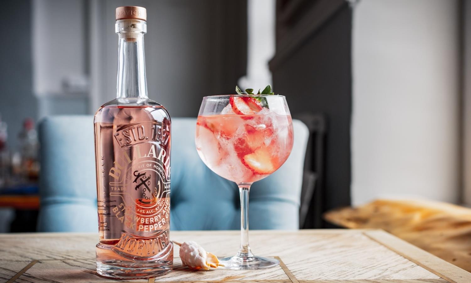 Pink gin bottle & cocktail on the Ship Inn table