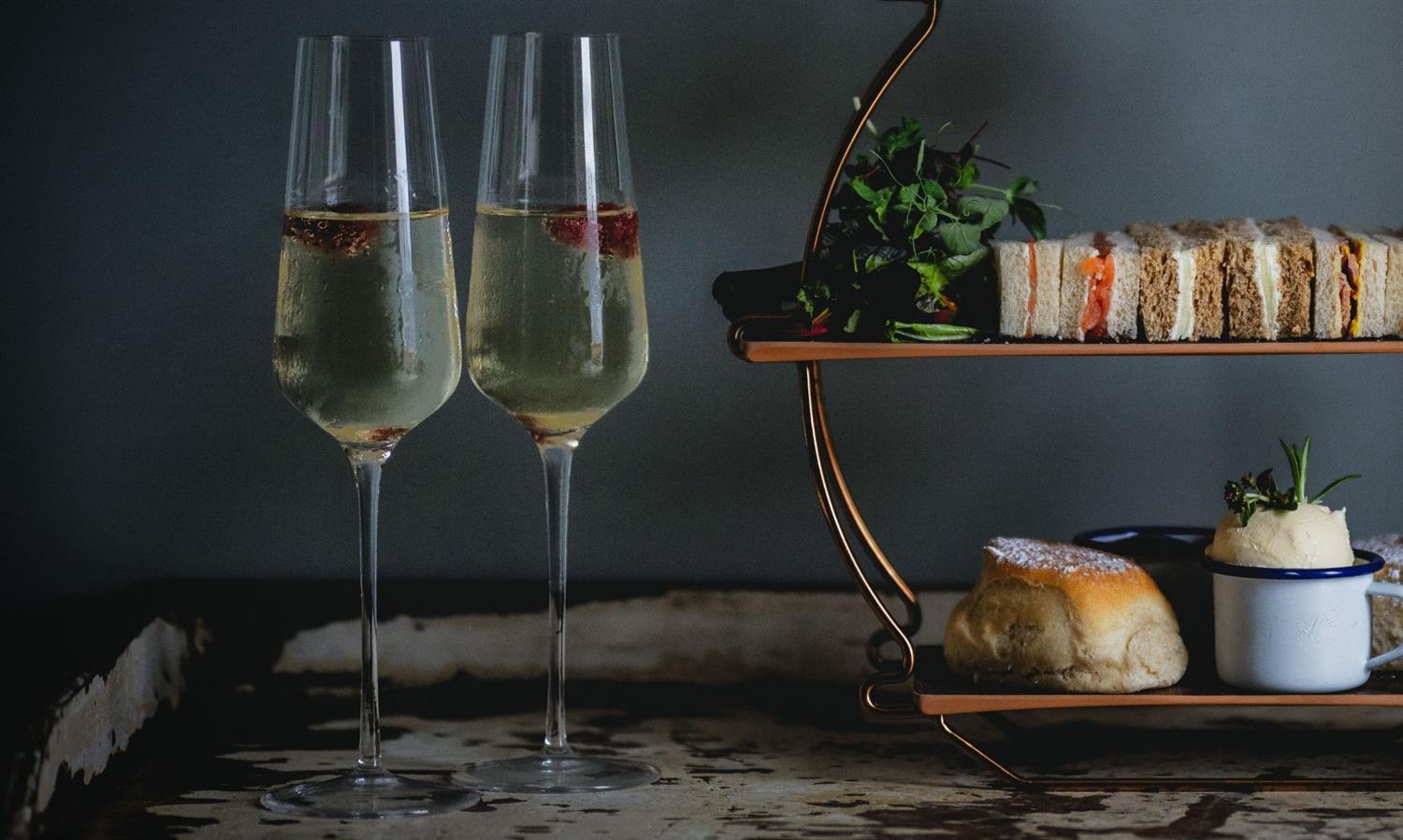 Champagne flutes next to Afternoon Tea at Widbrook Grange