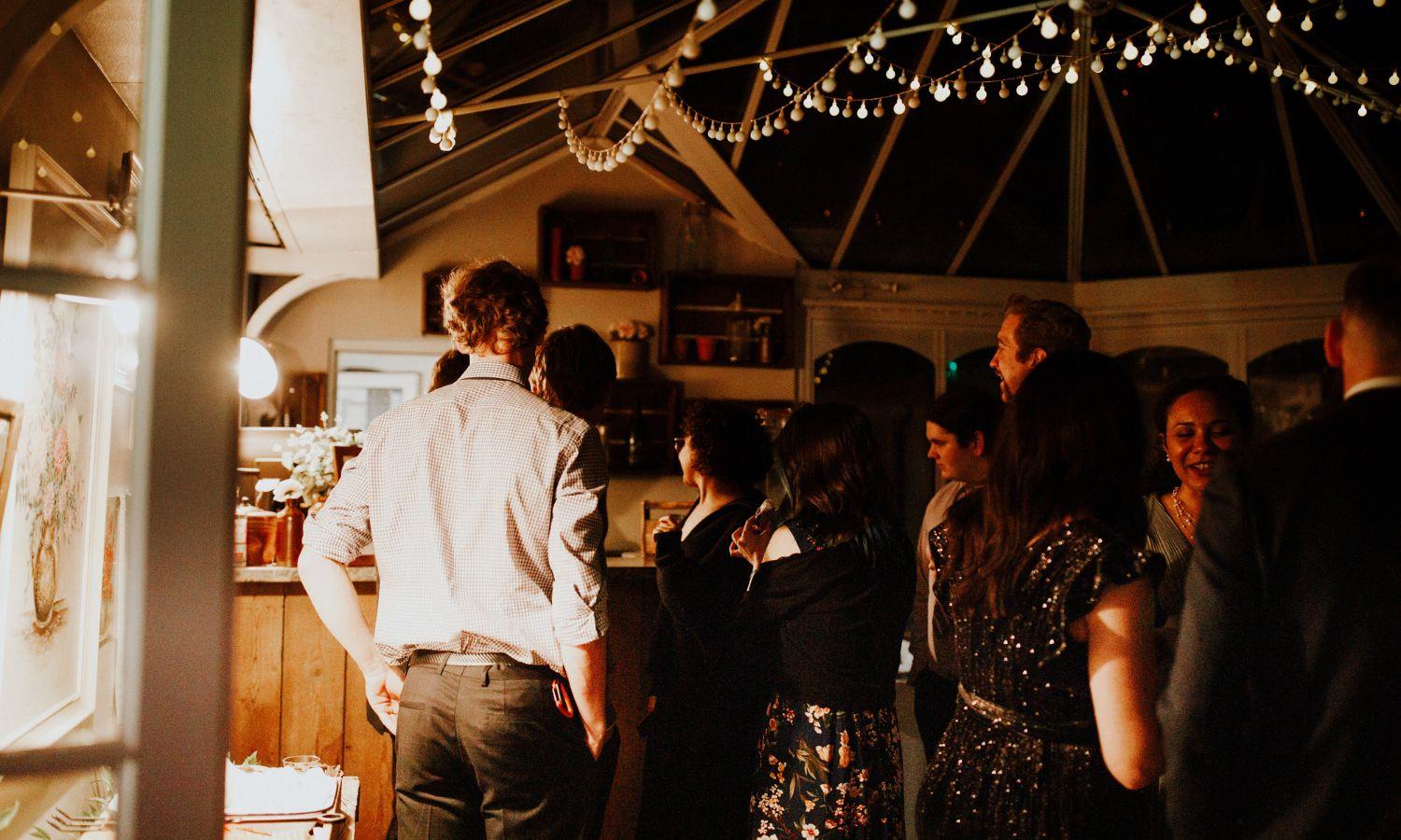 People enjoying a private party in a converted barn