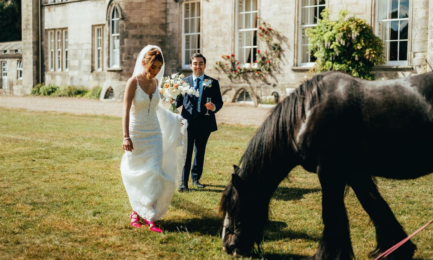 Wedding couple with horse in the grounds of Melville Castle