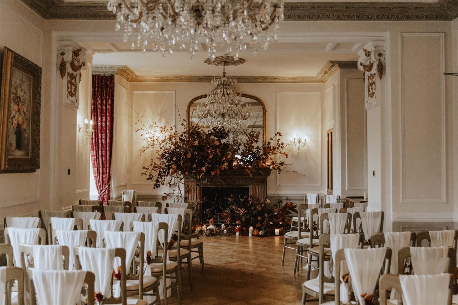 Candlelit wedding ceremony room at Auchen Castle in Scotland