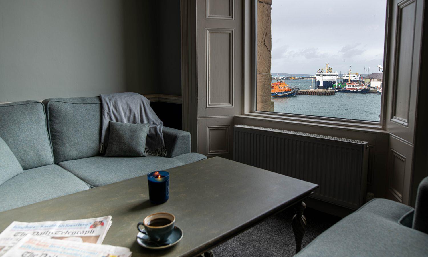 Cosy seating nook with window looking out over Kirkwall harbour