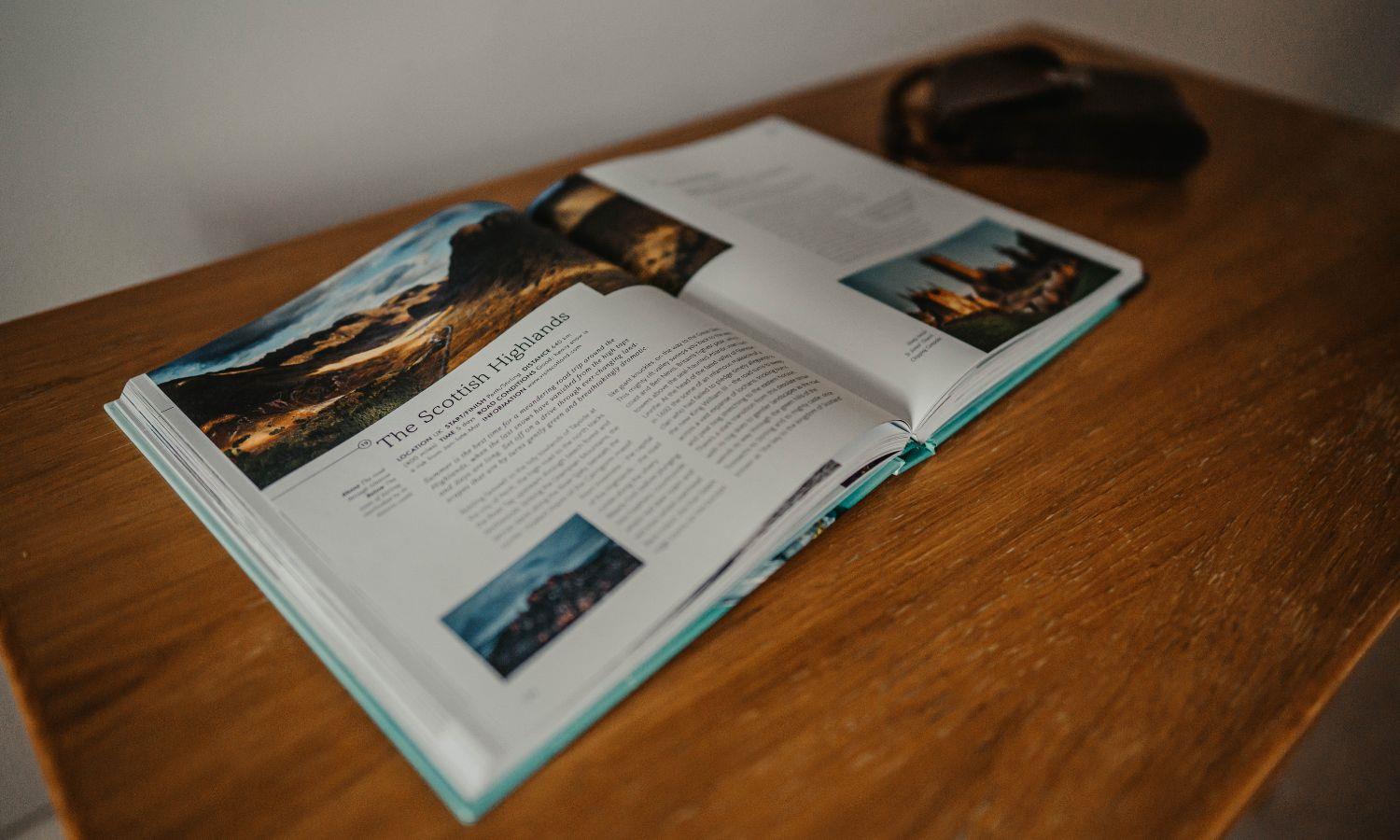Guidebook on table open to a page about the Highlands