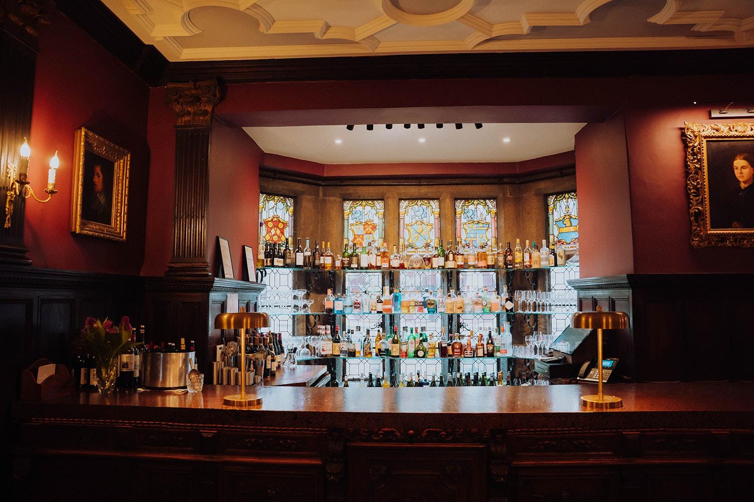 Bottles of spirit on the bar at Lewtrenchard Manor (c) Meilou Photography
