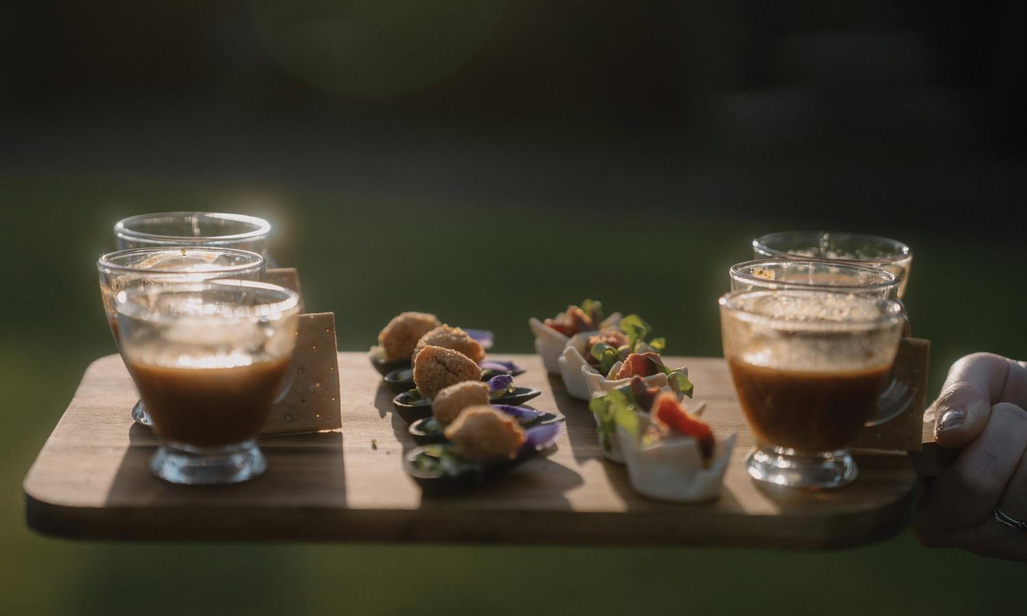 selection of canapes on wooden serving board
