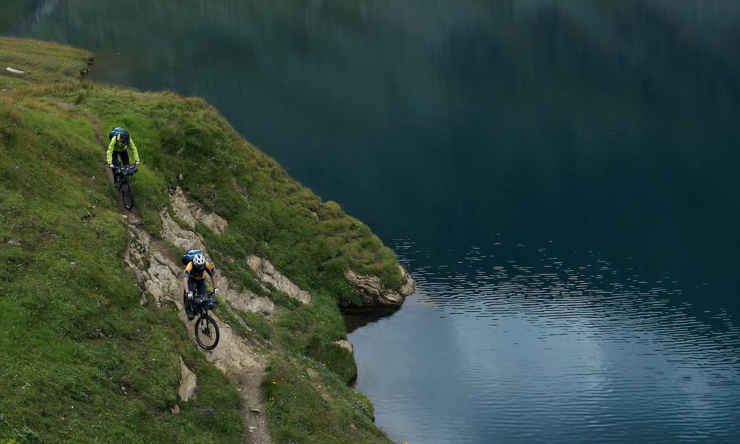 Mountain bikes down the side of a loch