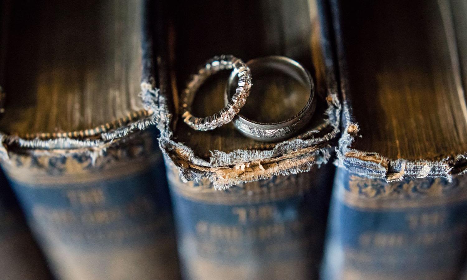Wedding rings on books