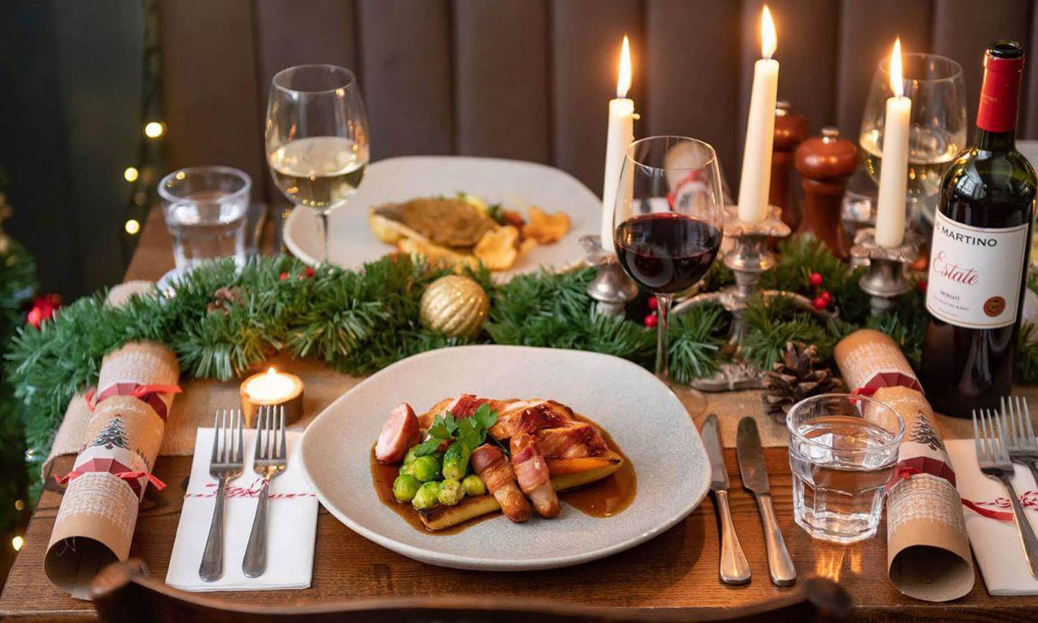 Christmas lunch with candles and crackers