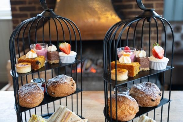 Champagne flutes next to Afternoon Tea at Elephant Hotel