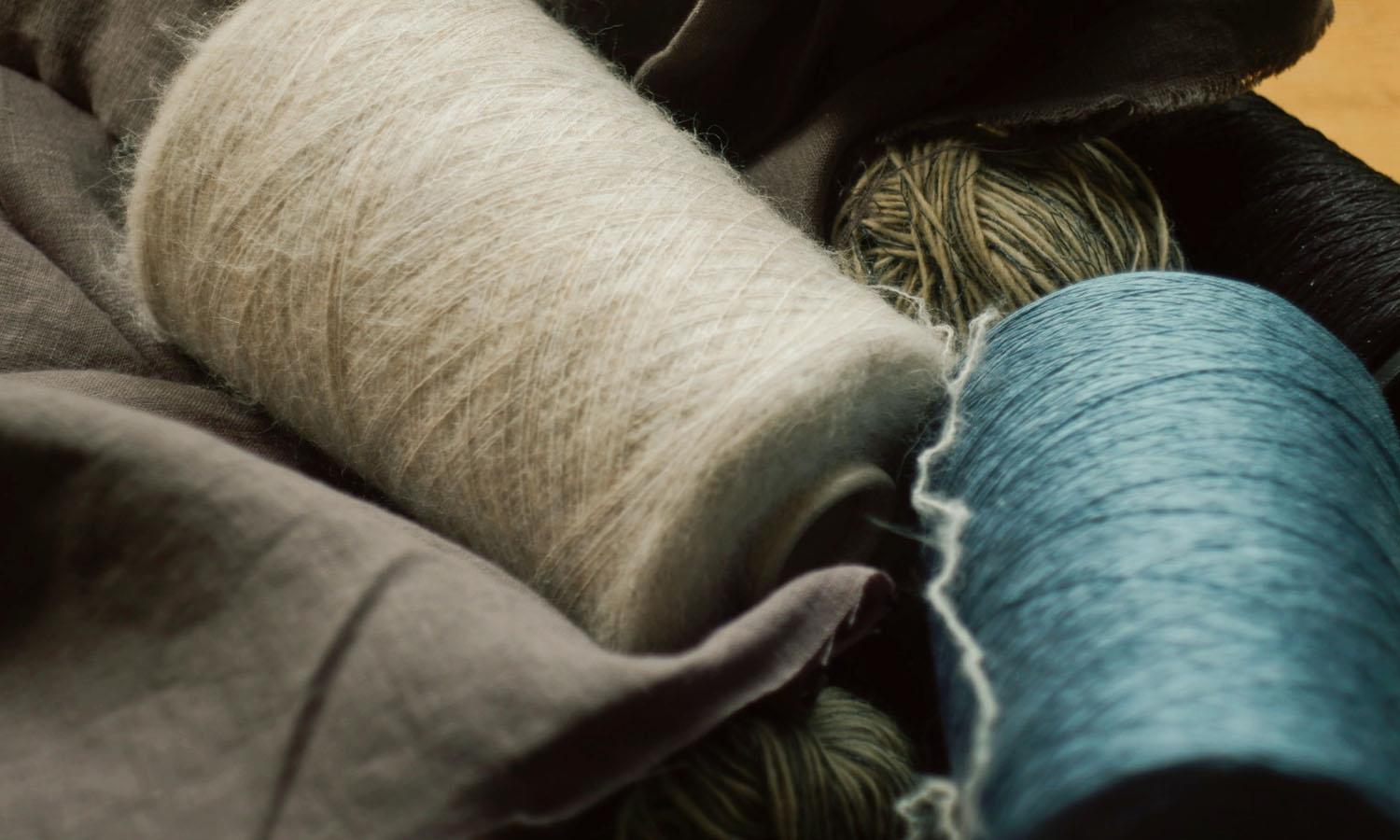 coloured spools of yarn