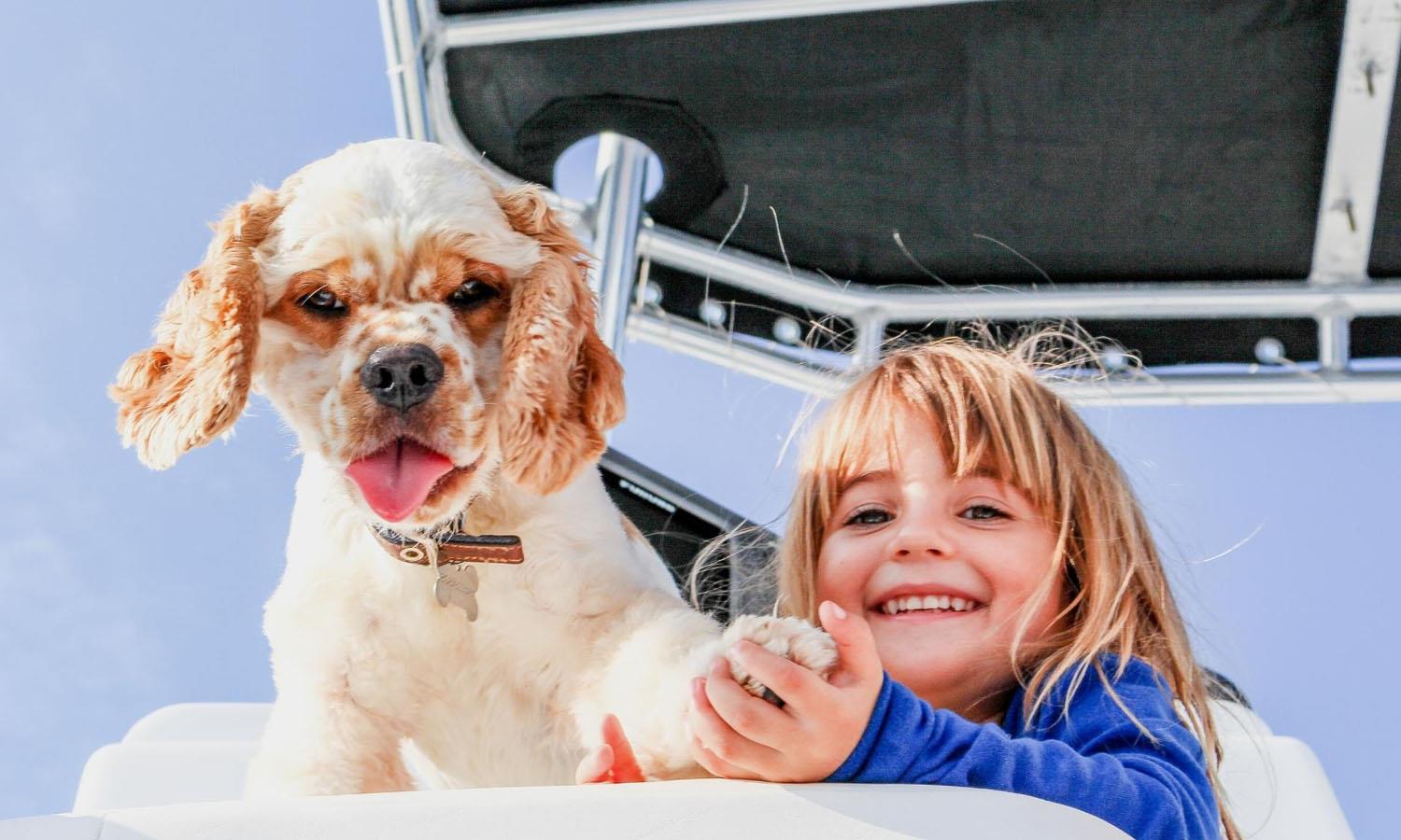 Dog with girl on boat