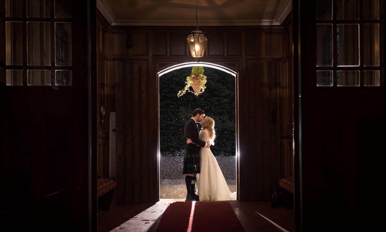 Married couple in doorway at Melville Castle