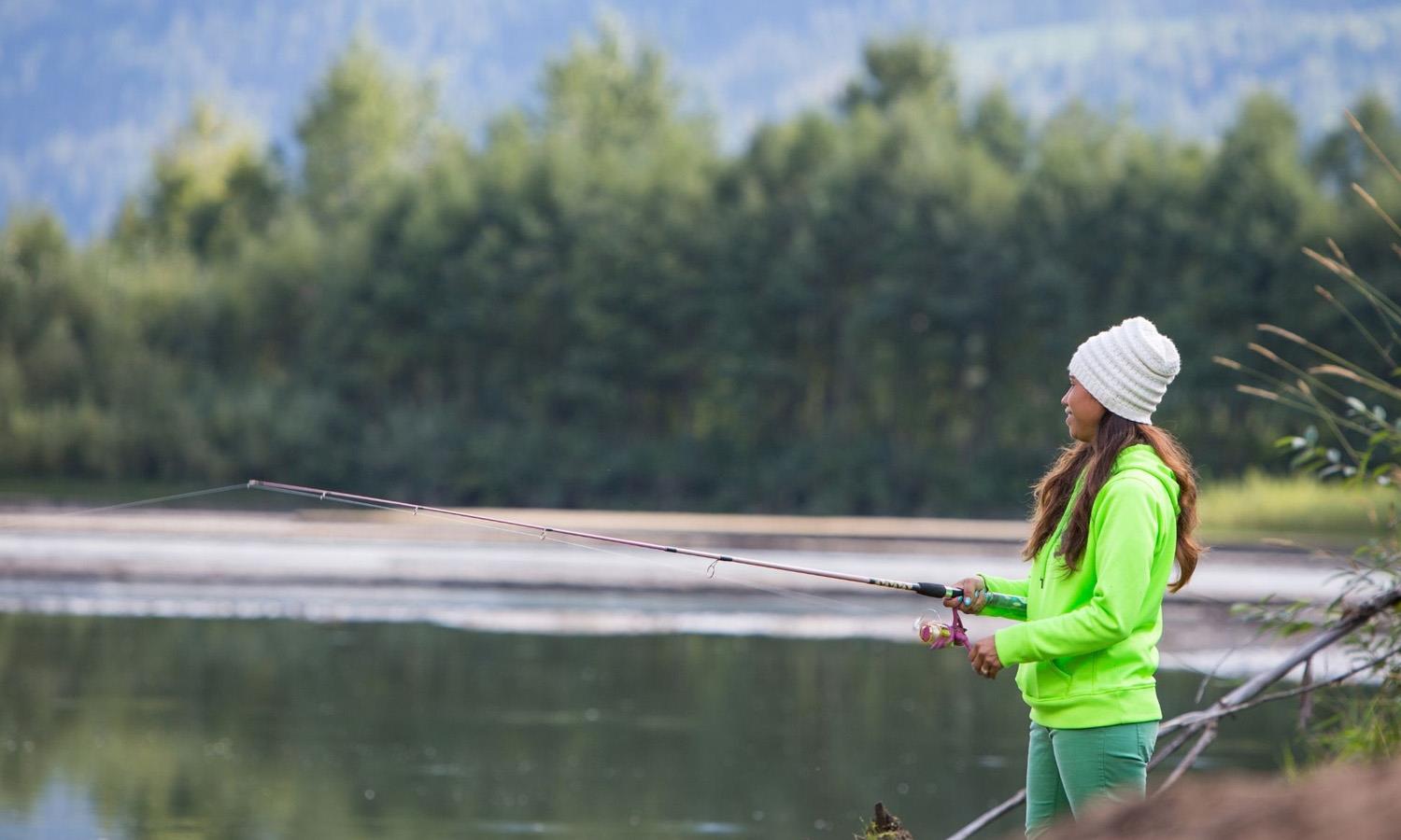 Woman fly fishing