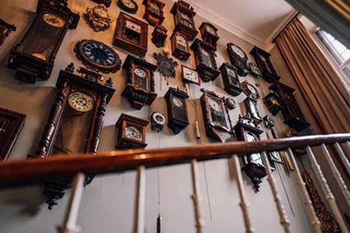 Clocks hanging on wall at Forss House Hotel