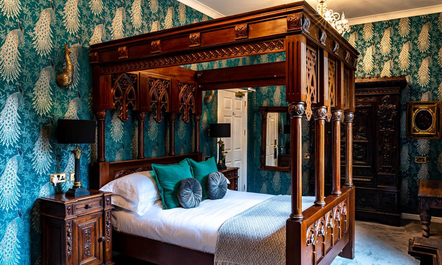 Luxury four-poster bedroom at Melville Castle