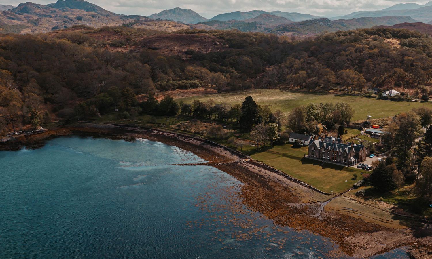 Aerial shot of Shieldaig Lodge Hotel showing lake