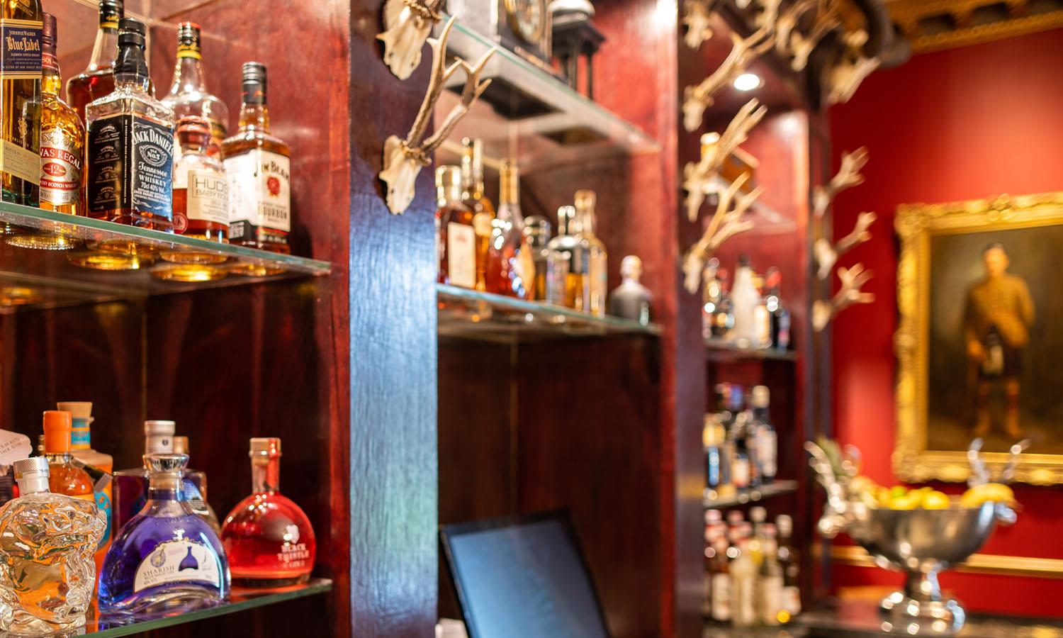 Whiskies and other drinks on display in the Library Bar
