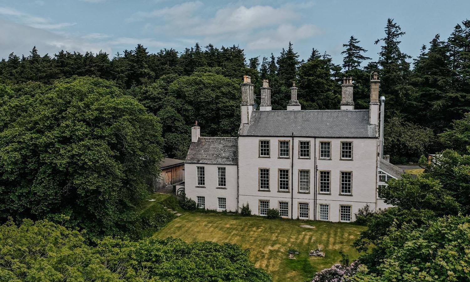 Front of Forss House hotel surrounded by forest