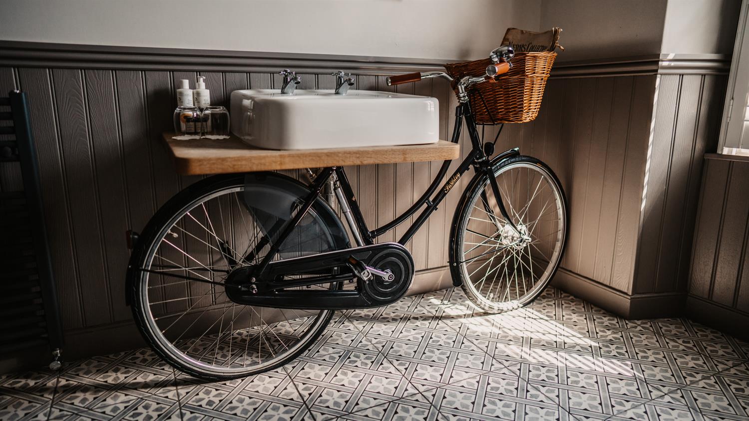 Bicycle propped against an internal wall at Widbrook Grange hotel near Bath