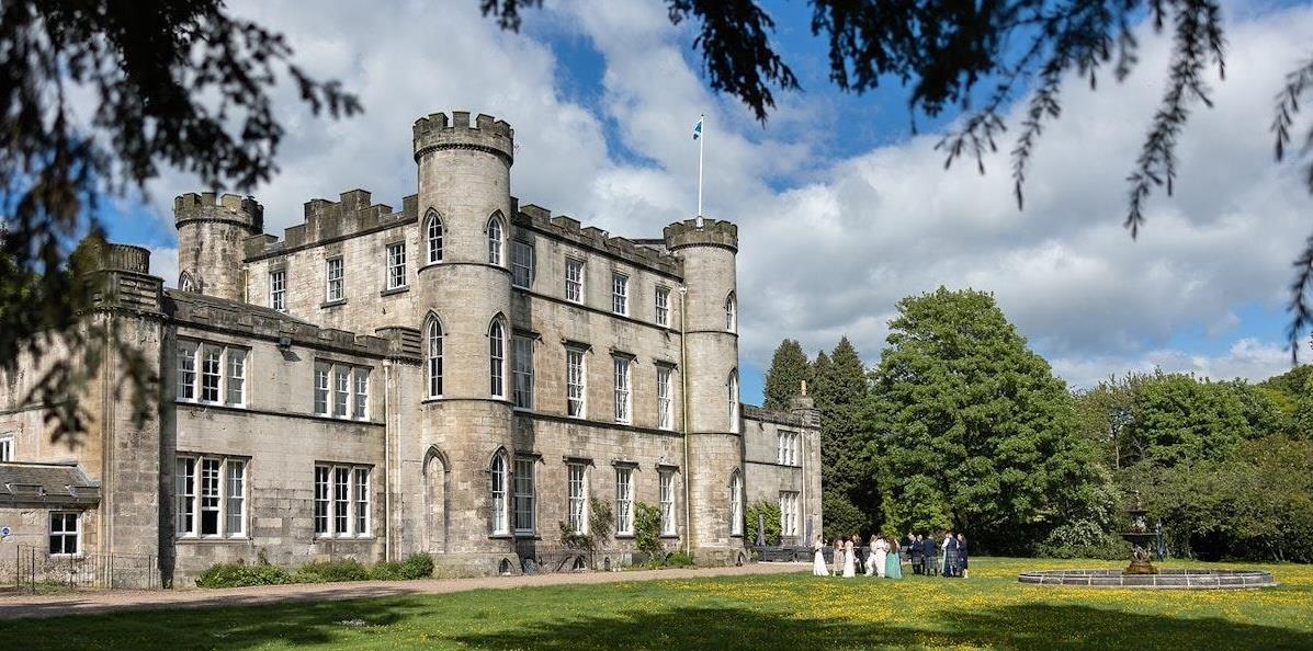 Wedding gathering in the grounds of Melville Castle