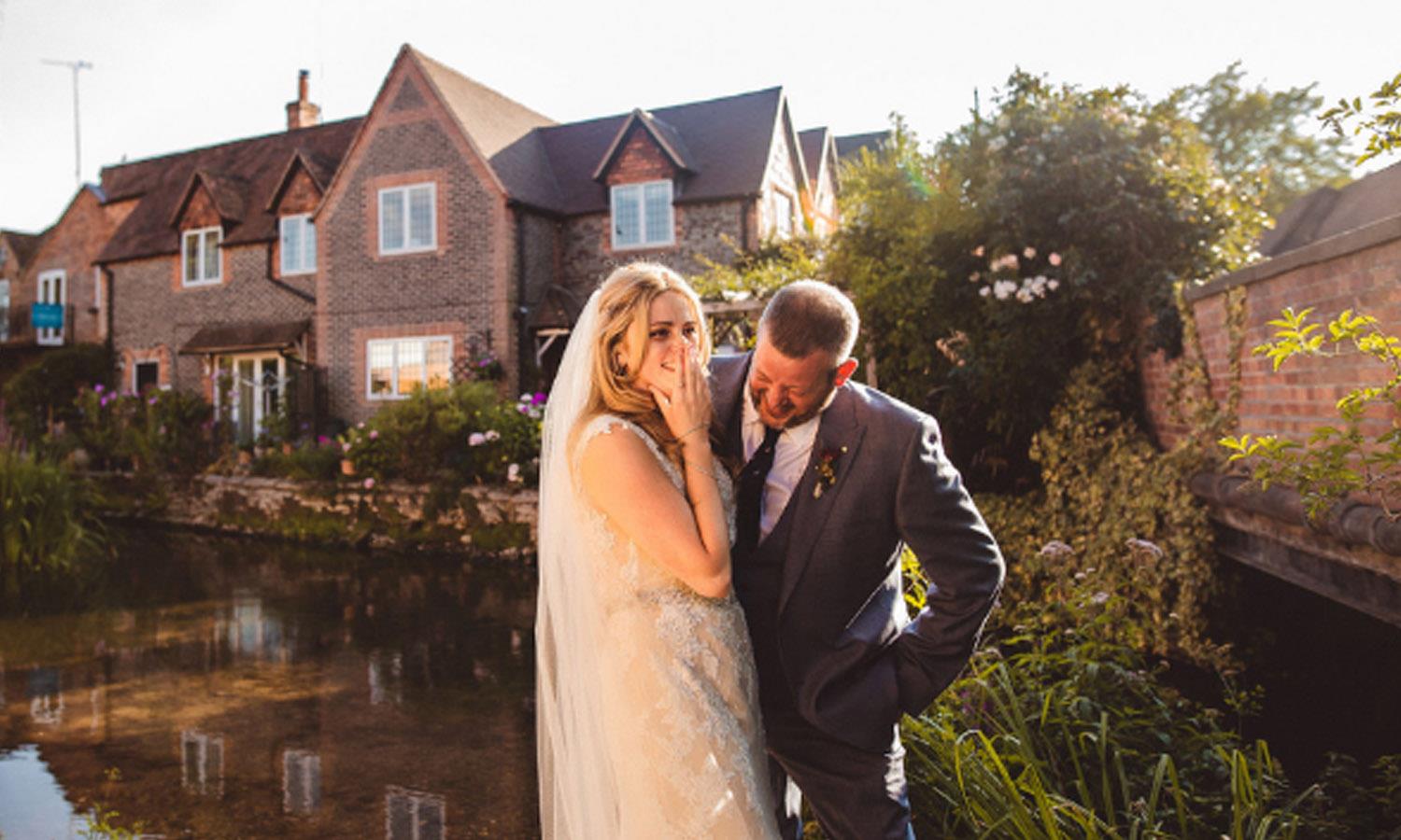 married couple by the thames at the Elephant Hotel in Pangbourne