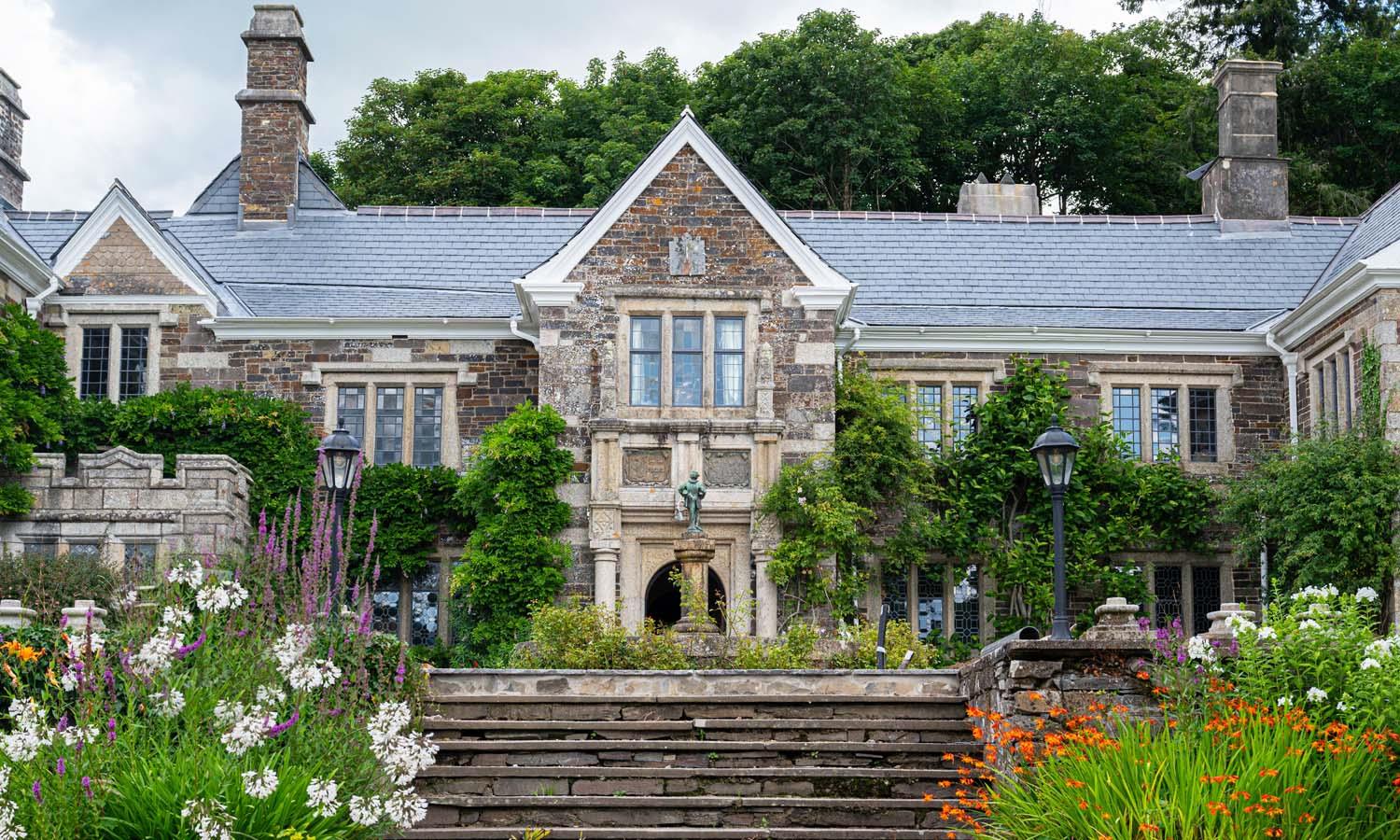 Exterior of Lewtrenchard Manor, front steps and flower garden