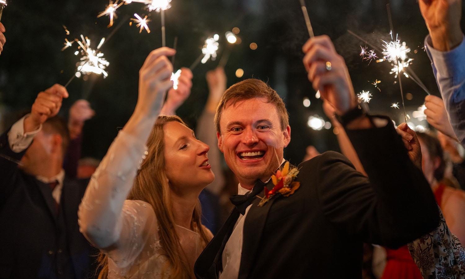 Wedded couple with sparklers