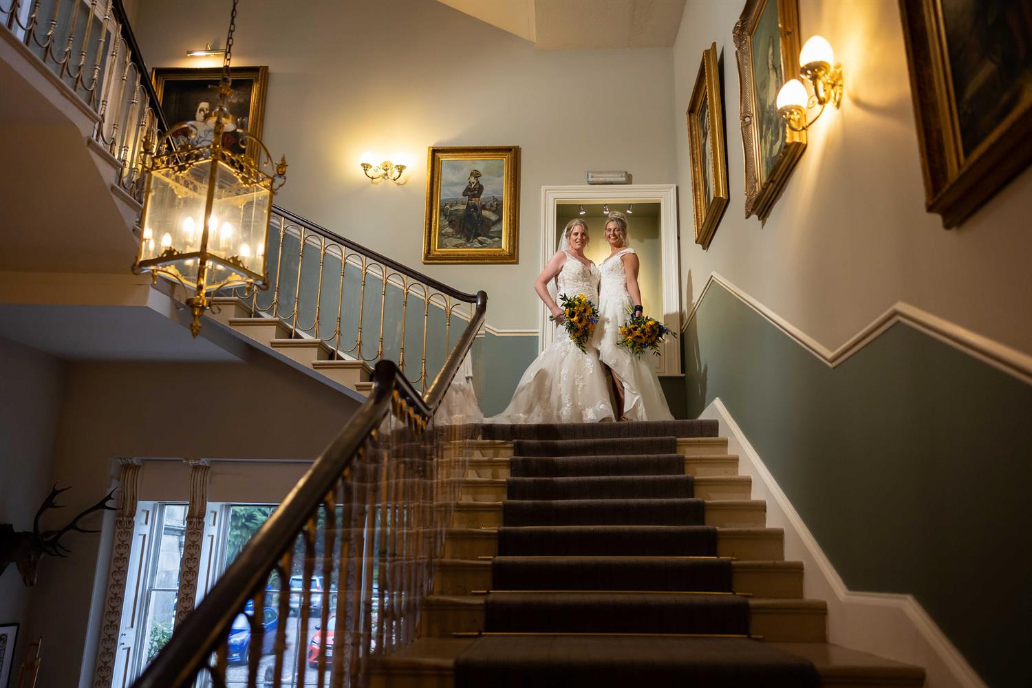 Two brides along the stairs