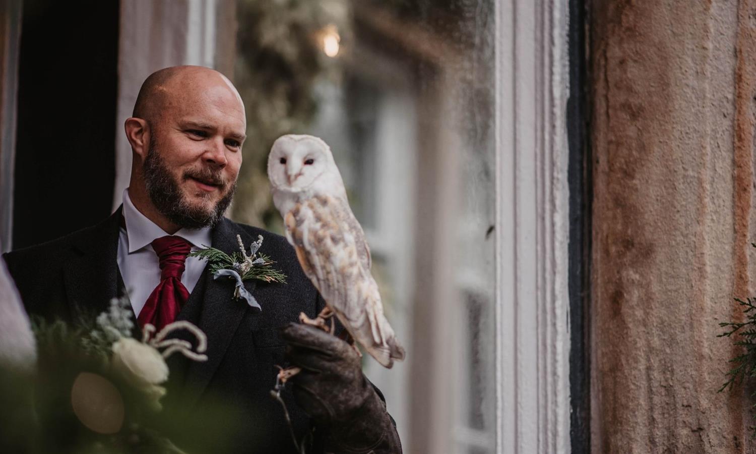 Groom with Barn Owl on his shoulder
