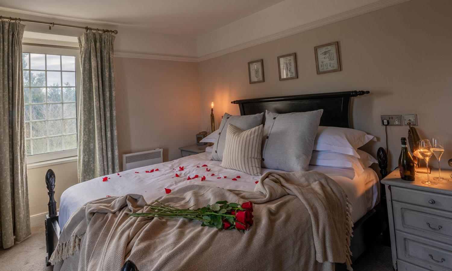 bed strewn with rose petals