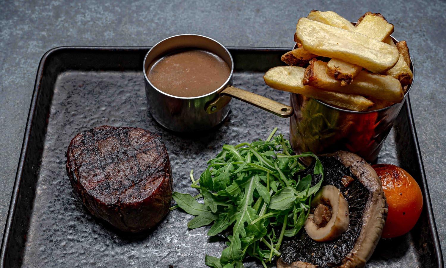 steak and chips at the herd restaurant, elephant hotel