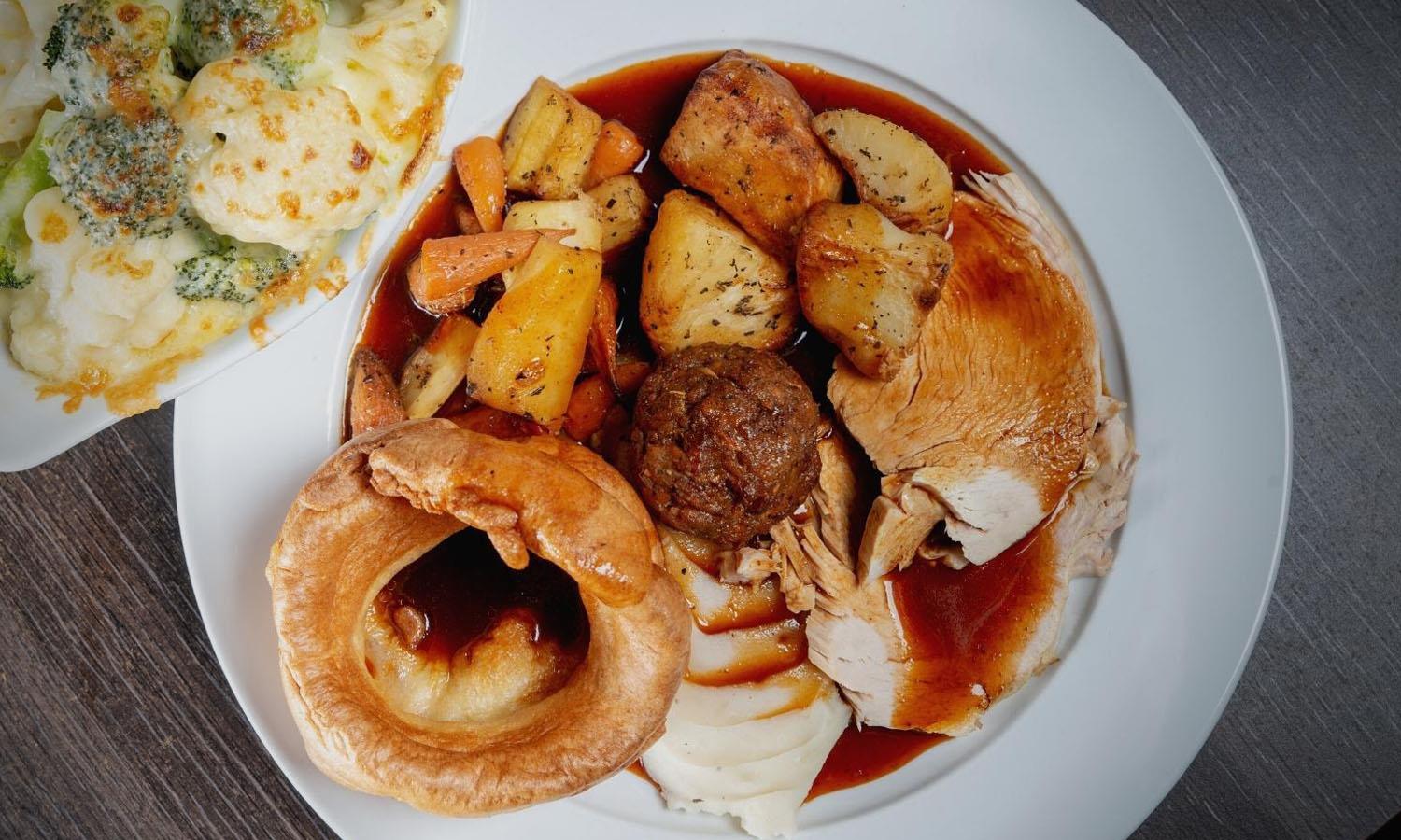 Sunday lunch with roast chicken, vegetables and Yorkshire pudding