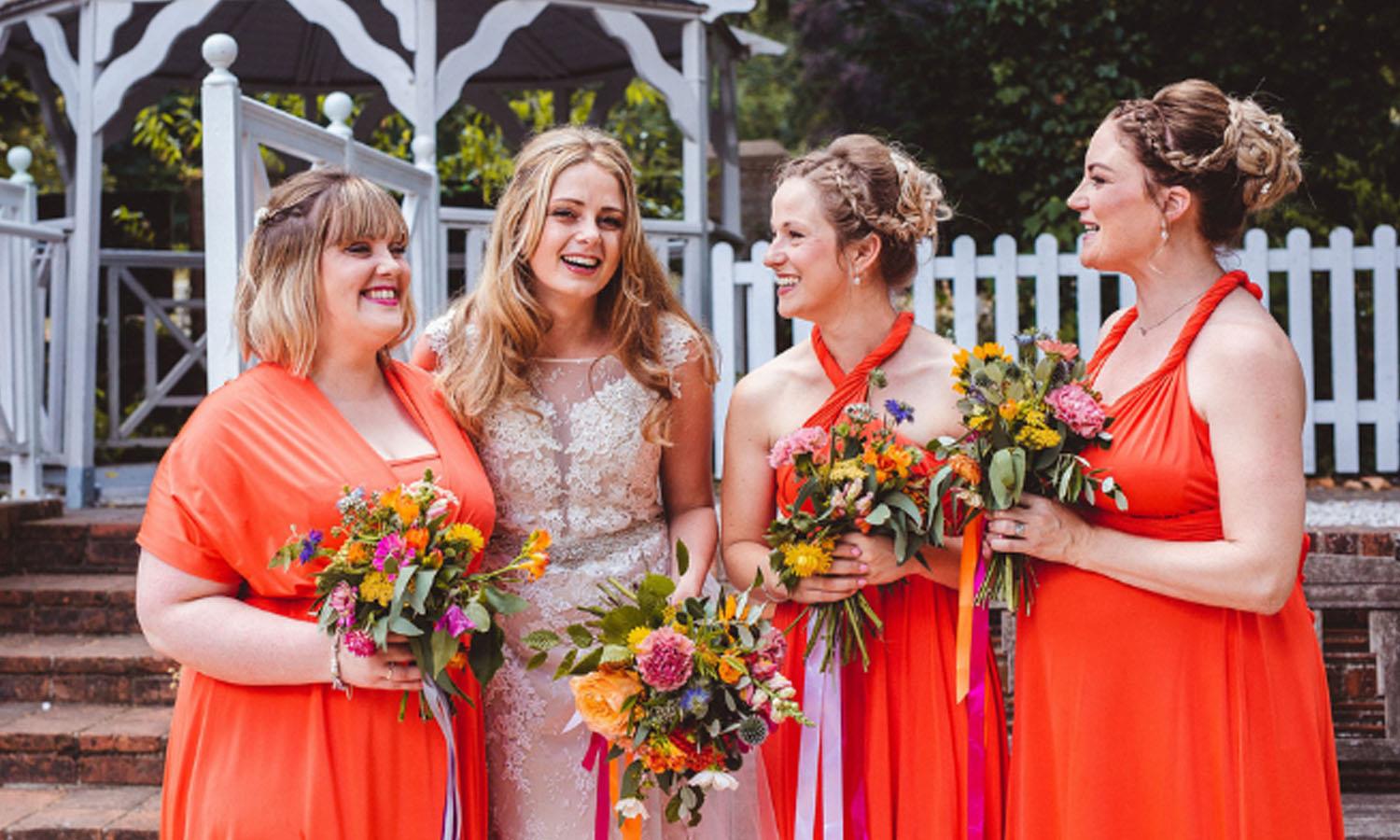 Bride and bridesmaids with flowers. Photo Credit: Nicola Casey Photography
