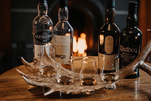 A whisky flight with a complimentary dram
